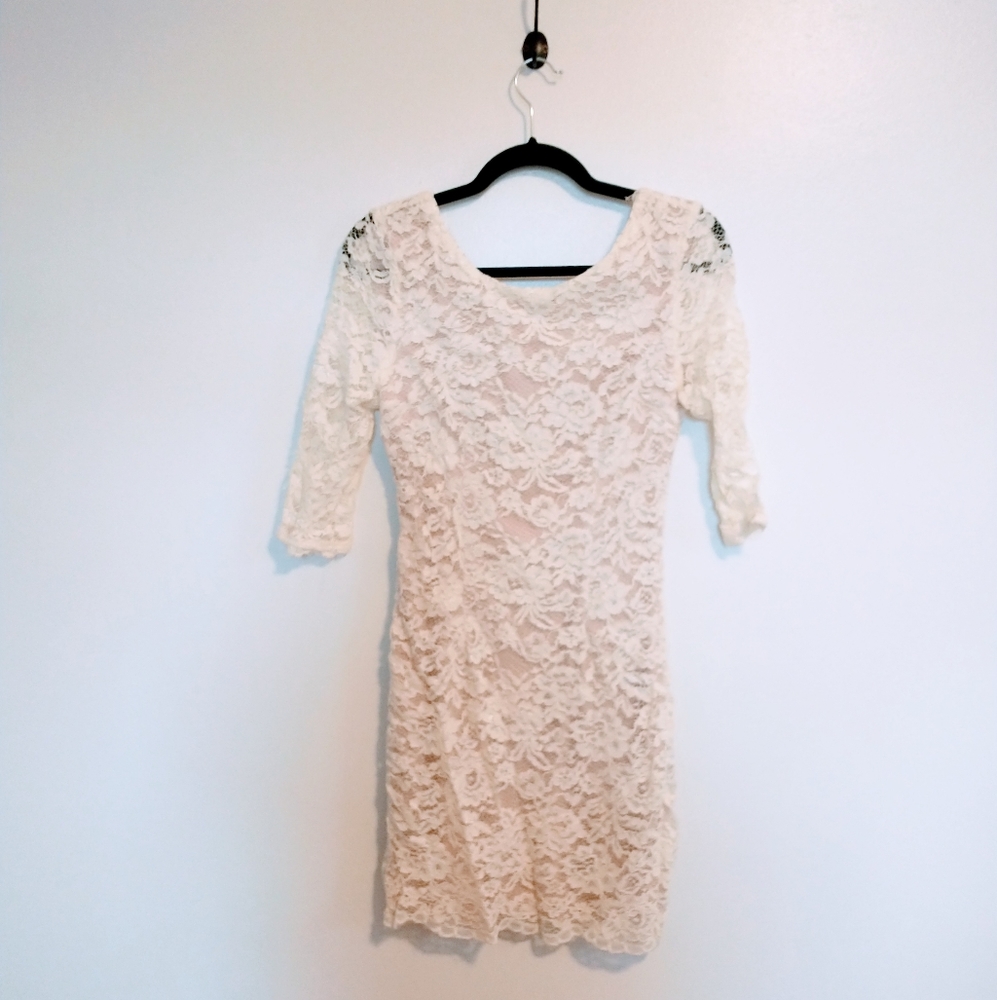 Soieble lace mini dress, half sleeves and low back. size medium.